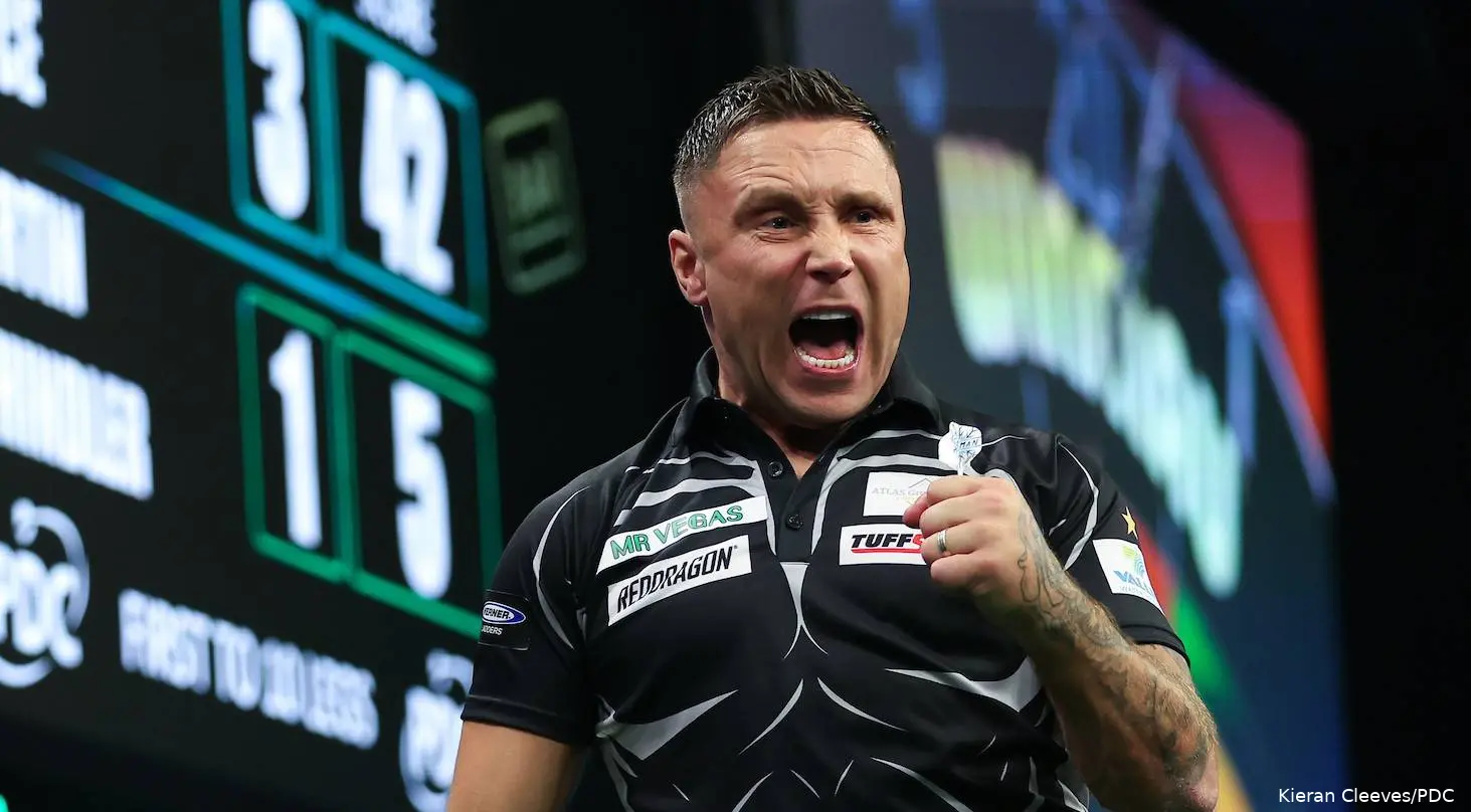 Gerwyn Price has mouth open and fist clenched letting out a roar against Martin Schindler.