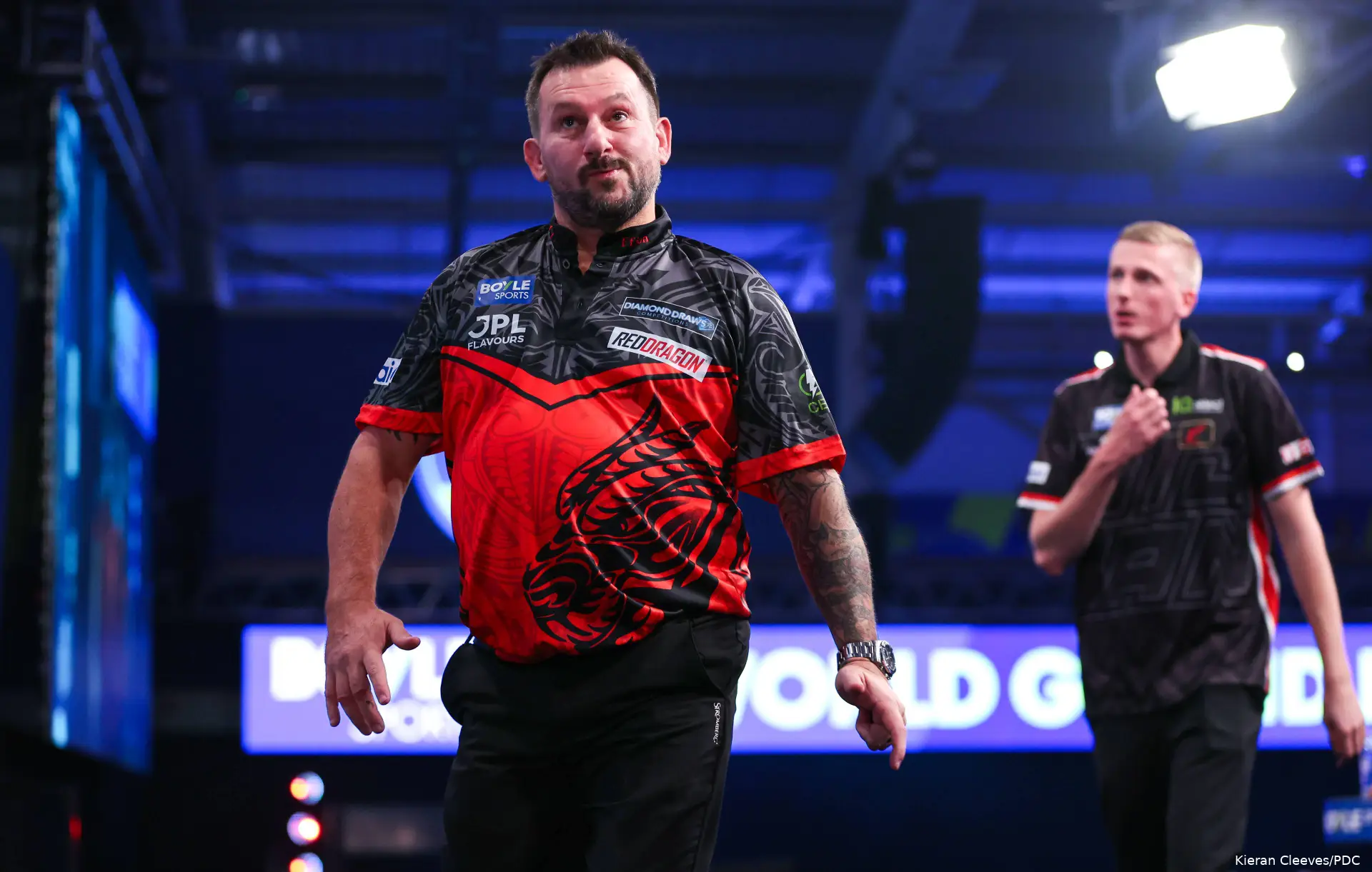 Jonny Clayton and Wessel Nijman head off stage at the 2026 World Grand Prix