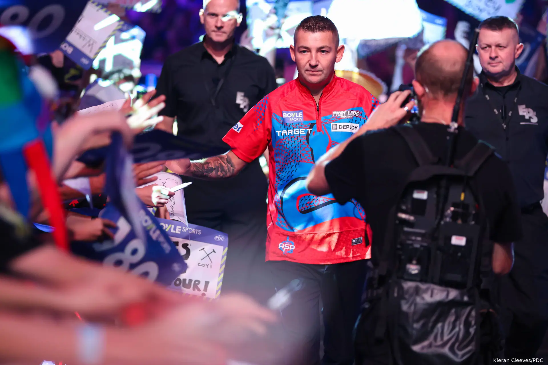 Nathan Aspinall walks on through the crowd at the 2026 World Grand Prix