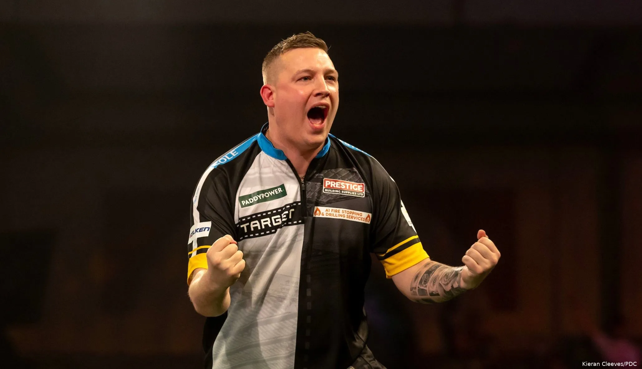 Chris Dobey pumps his fists after hitting a double