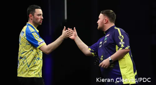 Luke Humphries and Luke Littler in action during the Premier League Darts