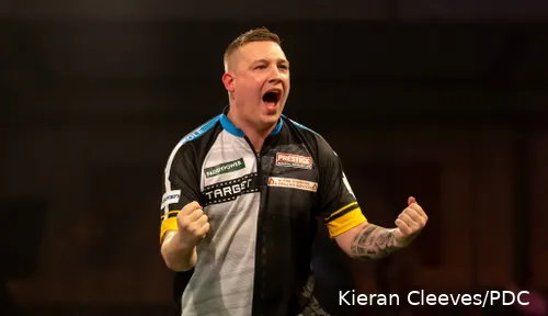 Chris Dobey pumps his fists after hitting a double