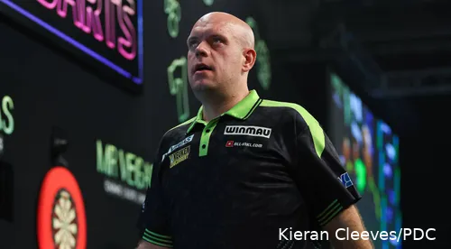 Michael van Gerwen stares into the distance on the World Darts Championship stage