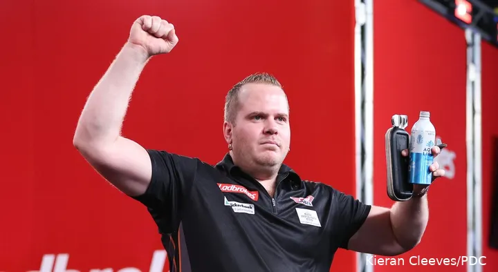 Dirk van Duijvenbode battles Madars Razma for a spot in the third round at the World Darts Championships