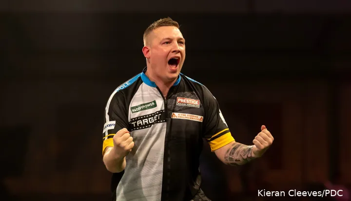 Chris Dobey pumps his fists after hitting a double