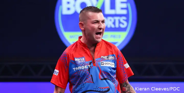 Nathan Aspinall celebrates.