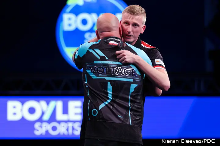 Wessel Nijman and Rob Cross embrace after their opening round match at the 2026 World Grand Prix