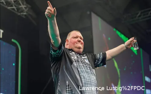 John Henderson is cheering in Aberdeen with a glass of water in his hand