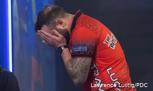 Joe Cullen covers his face with his hands.