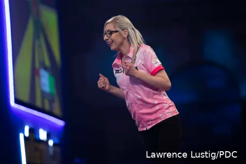 Fallon Sherrock pumps her fists after winning a leg