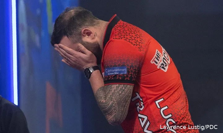 Joe Cullen covers his face with his hands.