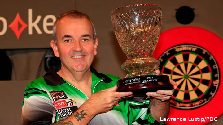 Phil Taylor poses with the World Grand Prix trophy