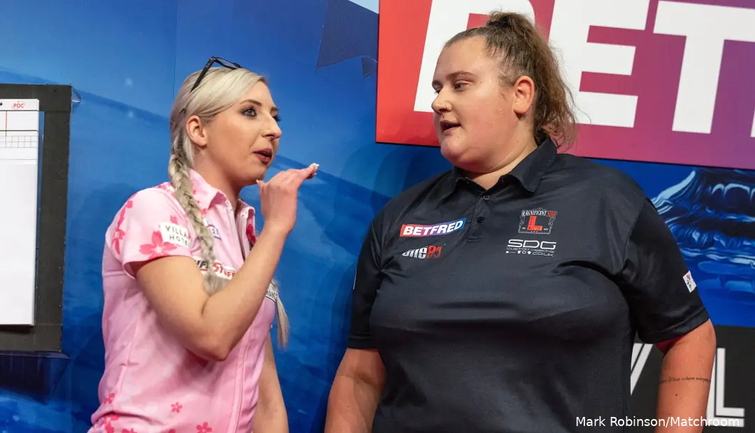 Fallon Sherrock and Beau Greaves talking to each other on stage