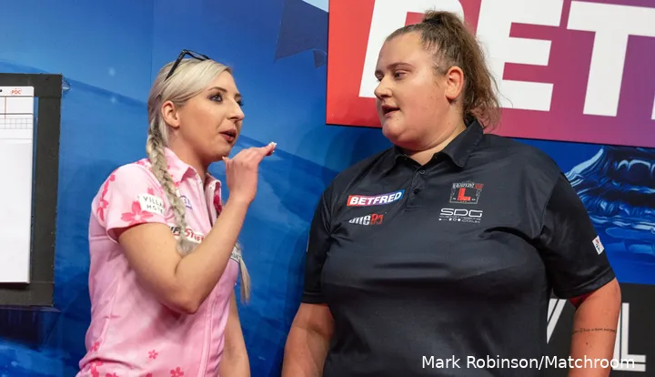 Fallon Sherrock and Beau Greaves in a discussion with each other on stage