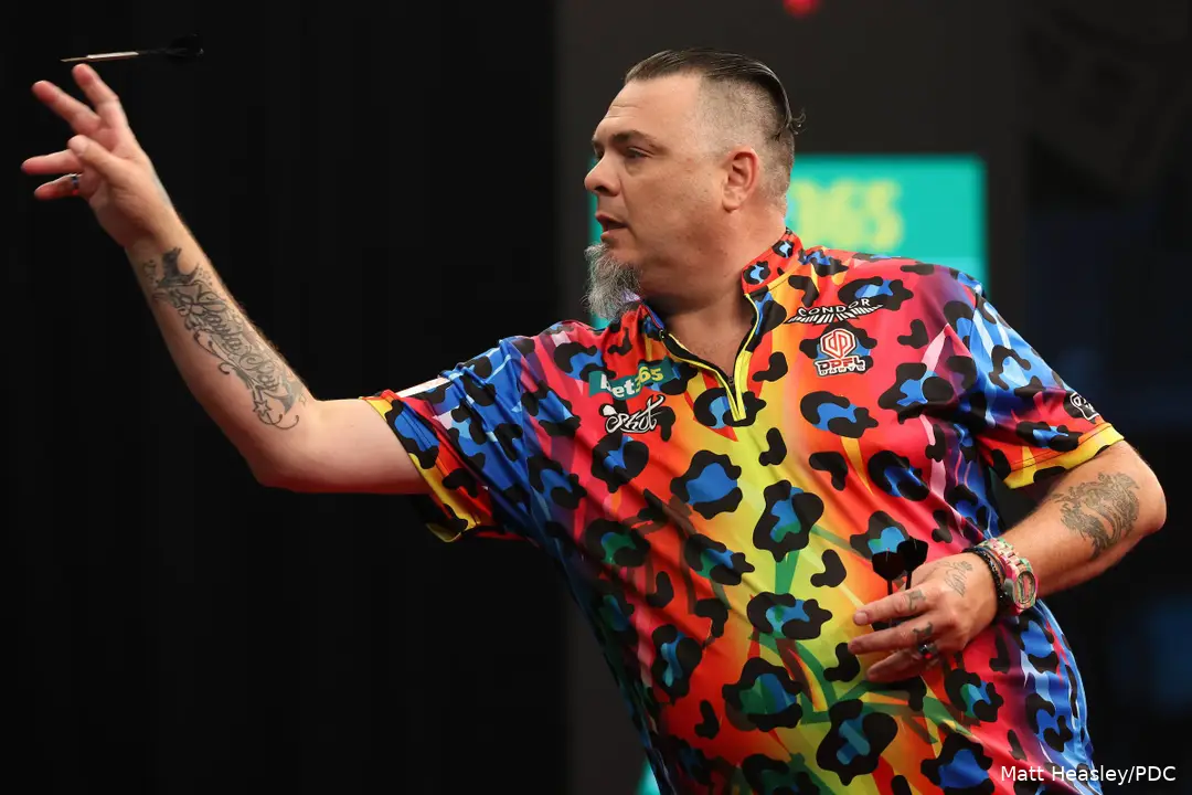 Buntz throws his dart at the board.