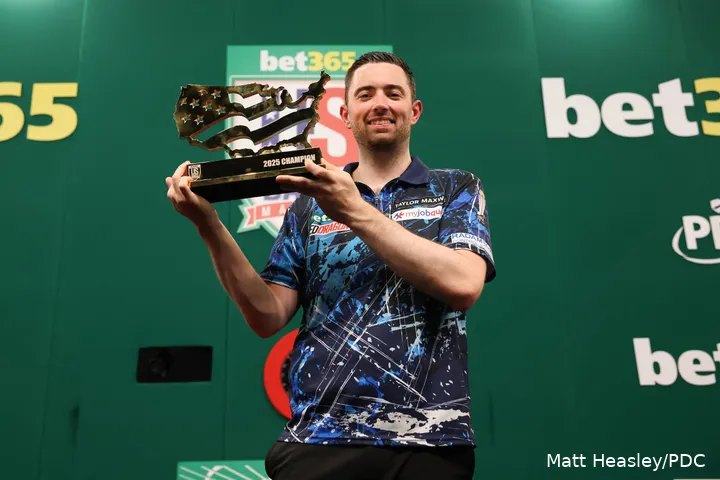 Luke Humphries holds the trophy he received after winning the US Darts Masters