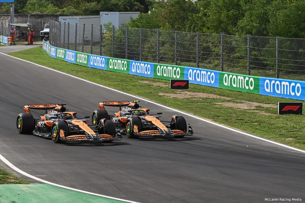 Lando Norris and Oscar Piastri side by side into Turn 4 on the opening lap of the 2024 Italian Grand Prix, with Norris on the inside line.