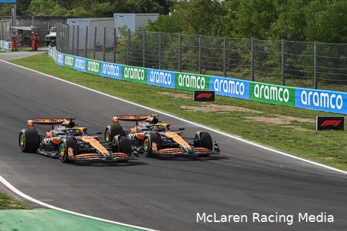 Lando Norris and Oscar Piastri side by side into Turn 4 on the opening lap of the 2024 Italian Grand Prix, with Norris on the inside line.