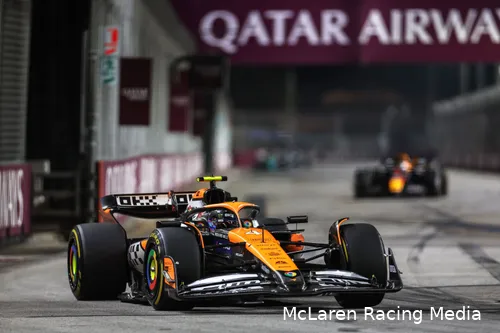 Lando Norris leading the 2024 Singapore Grand Prix, with Max Verstappen following him in the background.&amp;amp;nbsp;
