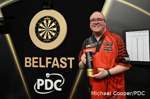 Stephen Bunting poses proudly on stage