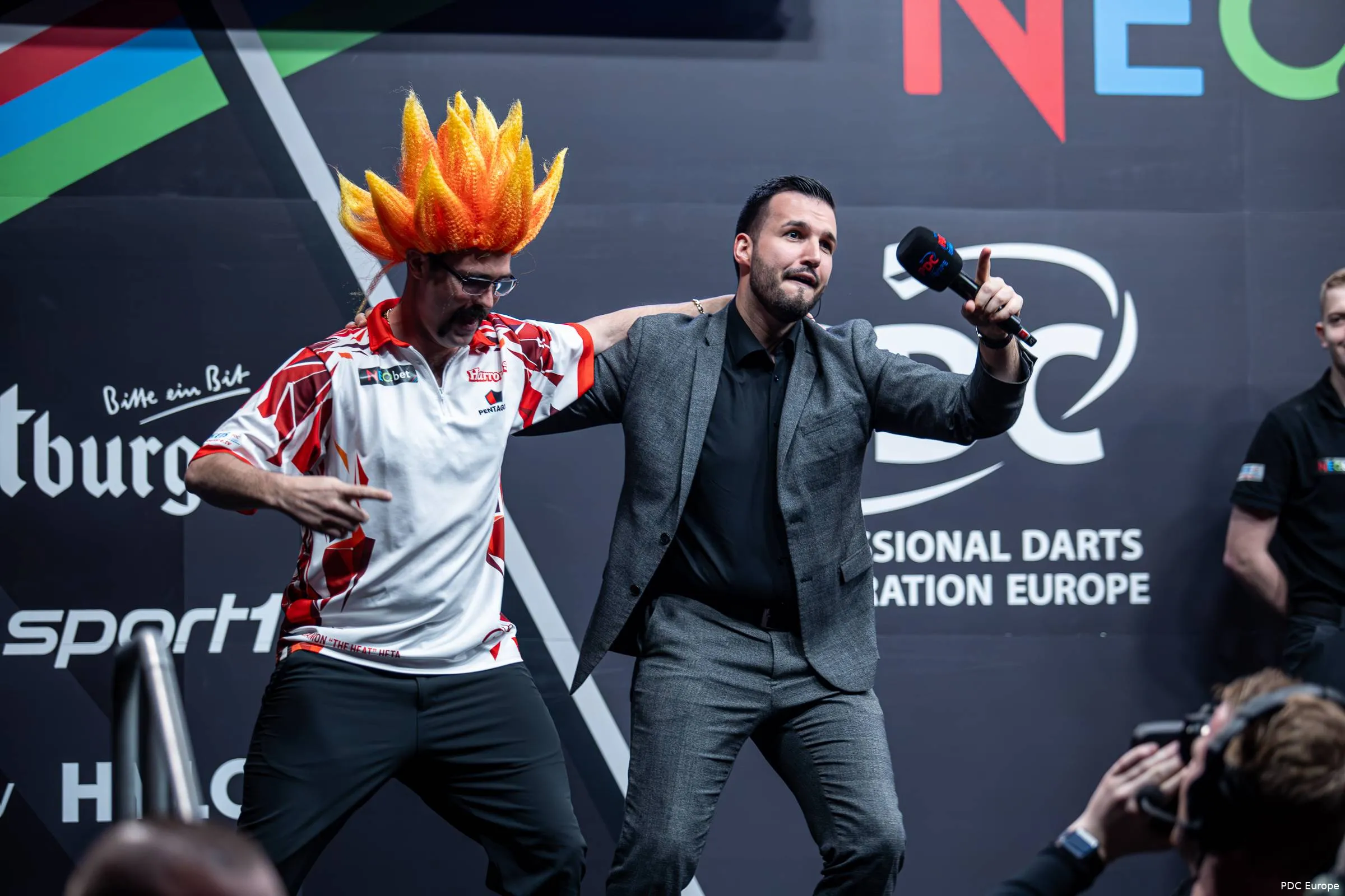Philip Brzezinski and Damon Heta dance together on stage during the walk-on.