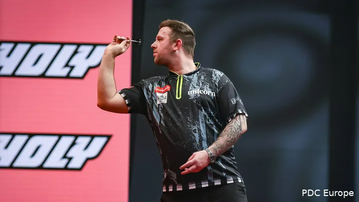 Callan Rydz throws a dart.