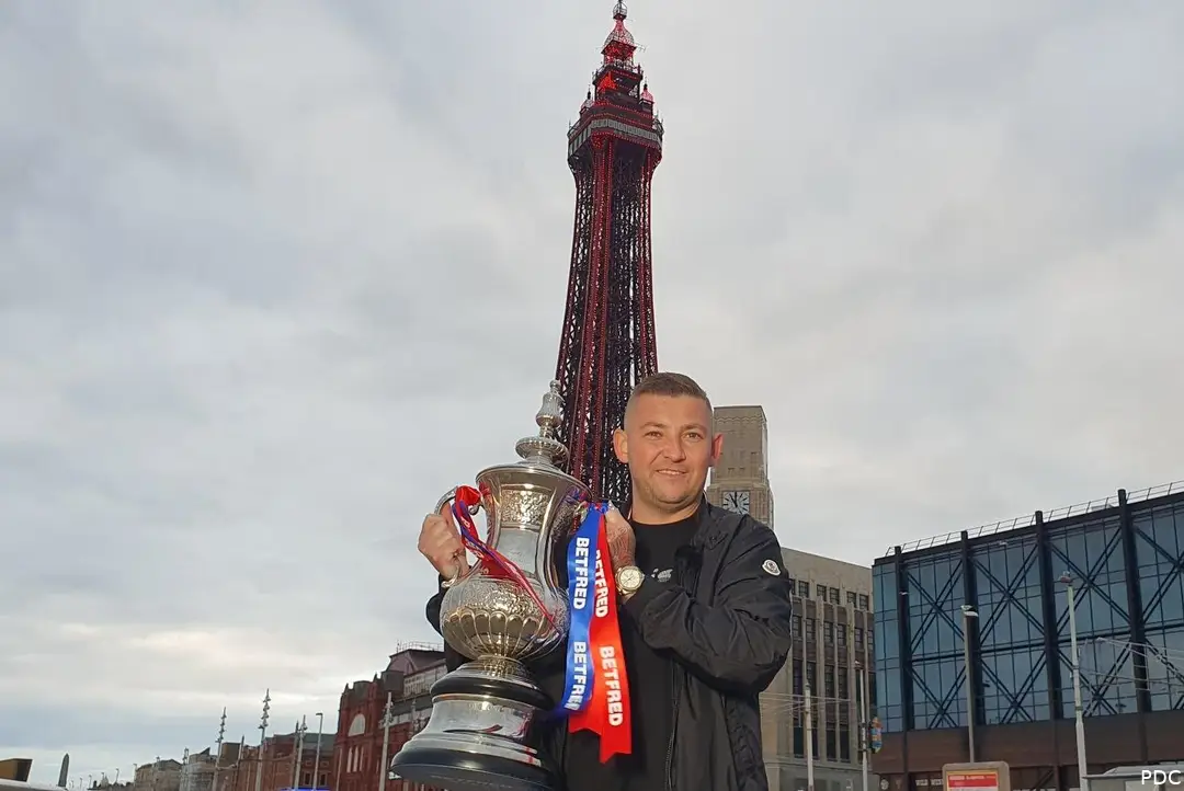 Nathan Aspinall with his title and the newly adorned Blackpool Tower.