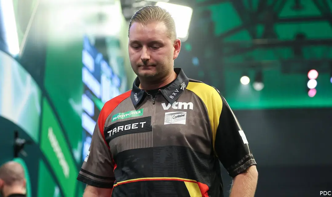 Dimitri Van den Bergh looks down in disappointment as he walks off the stage.