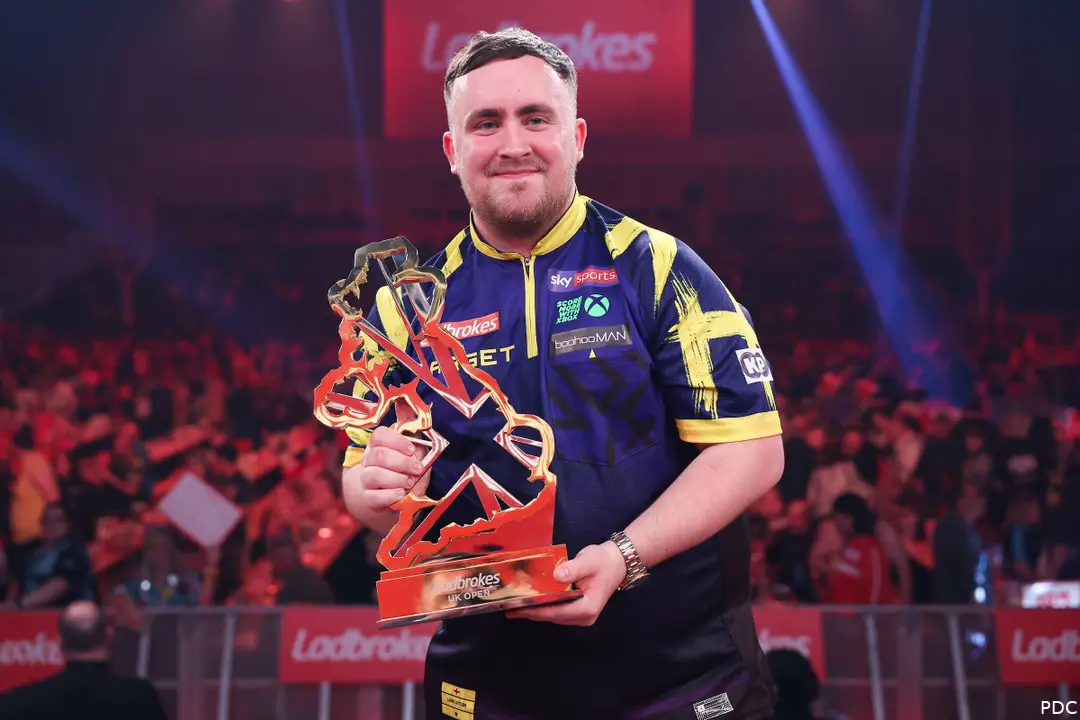 Luke Littler proudly poses with his UK Open trophy