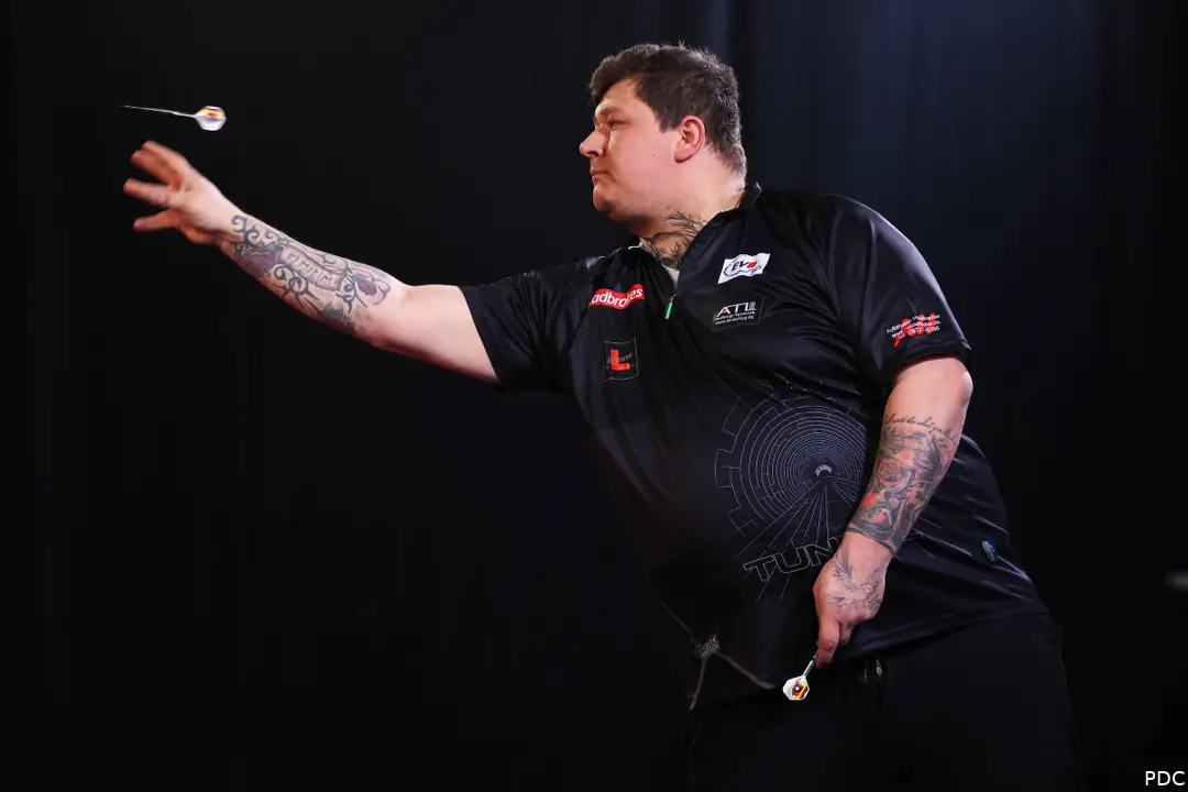 Kai Gotthardt throws a dart.