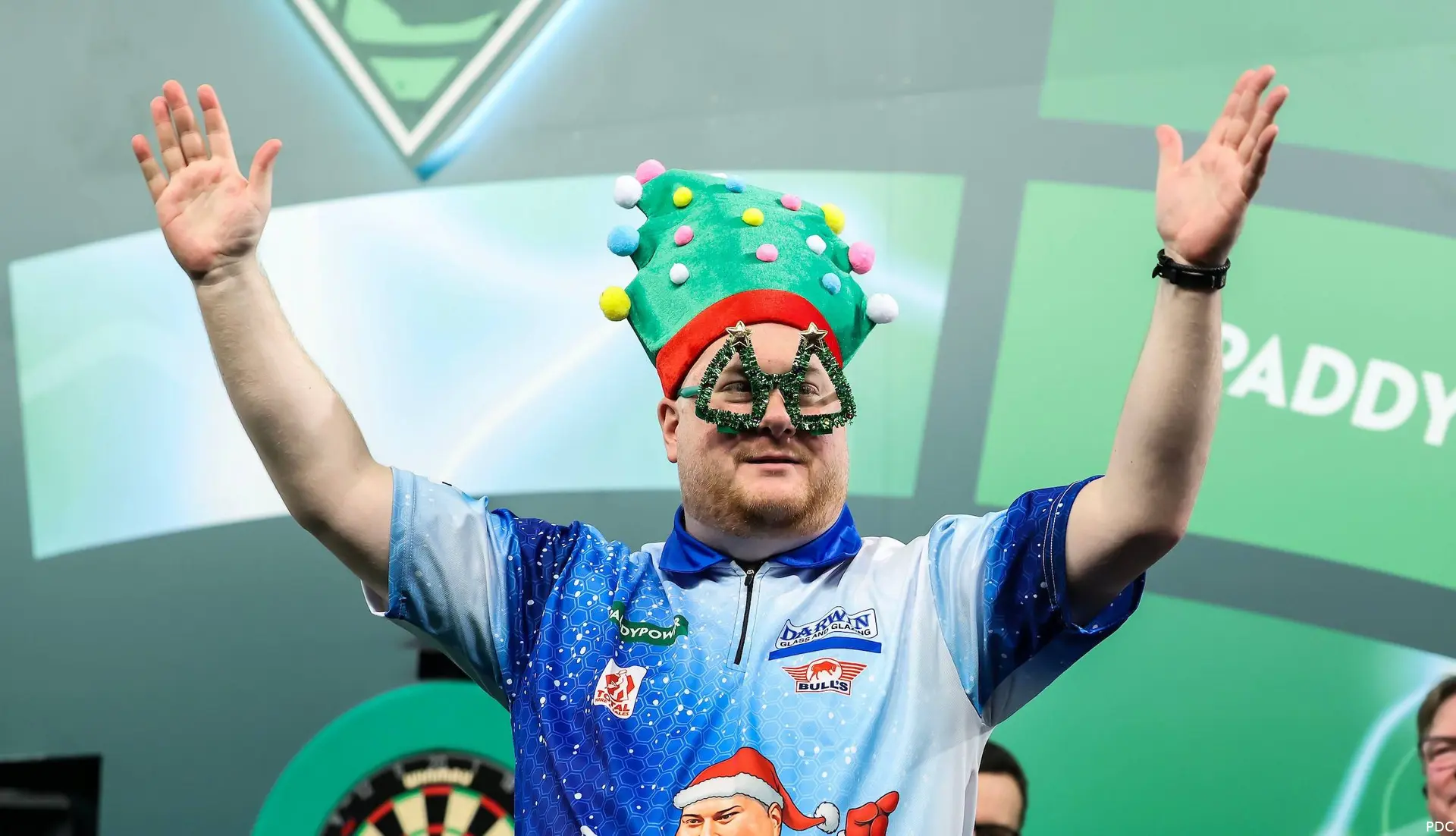 Ricky Evans brought the festive spirit to the World Darts Championship with a Christmas-themed walk-on
