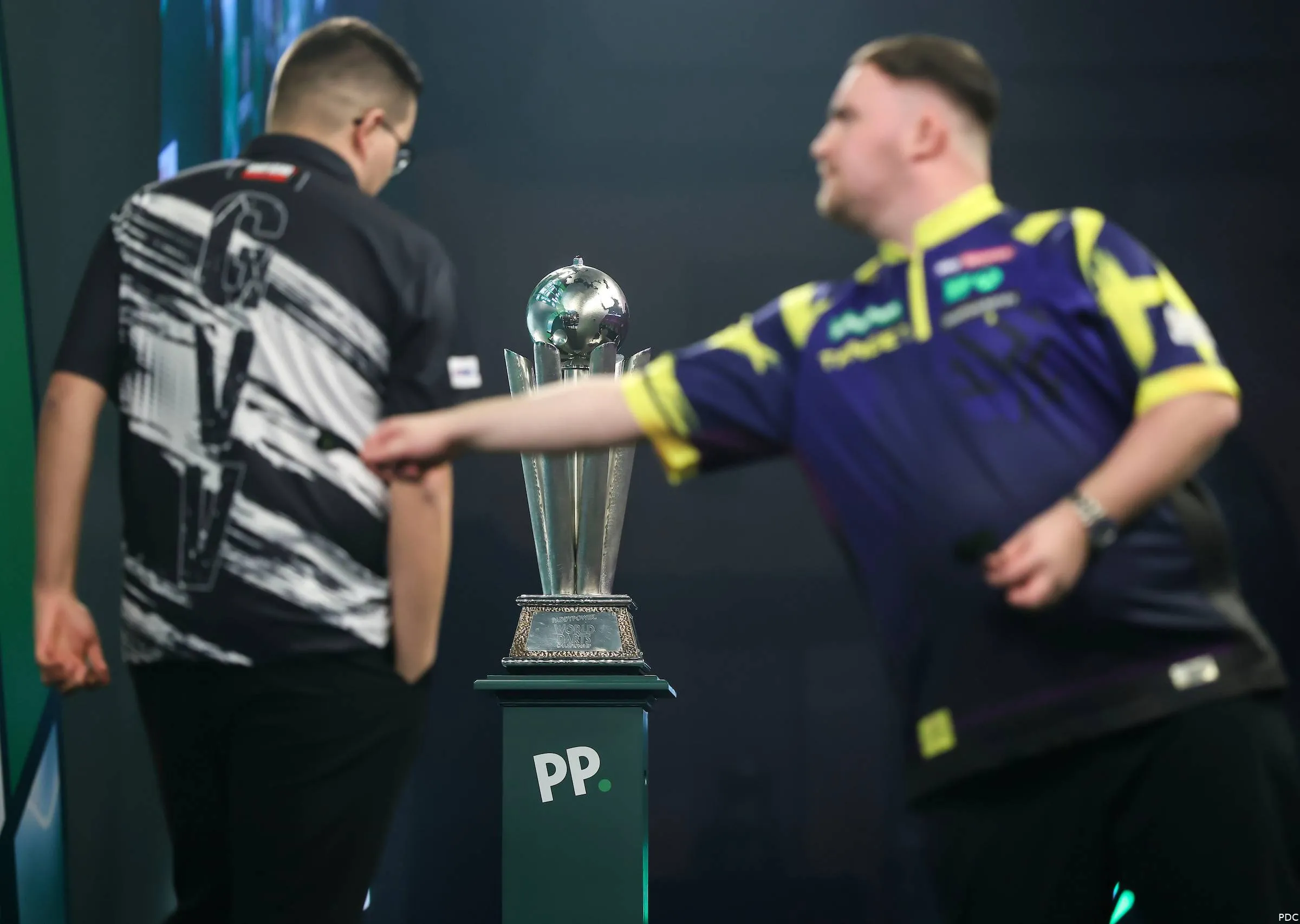 Luke Littler and Gian van Veen in action during the World Darts Championship final