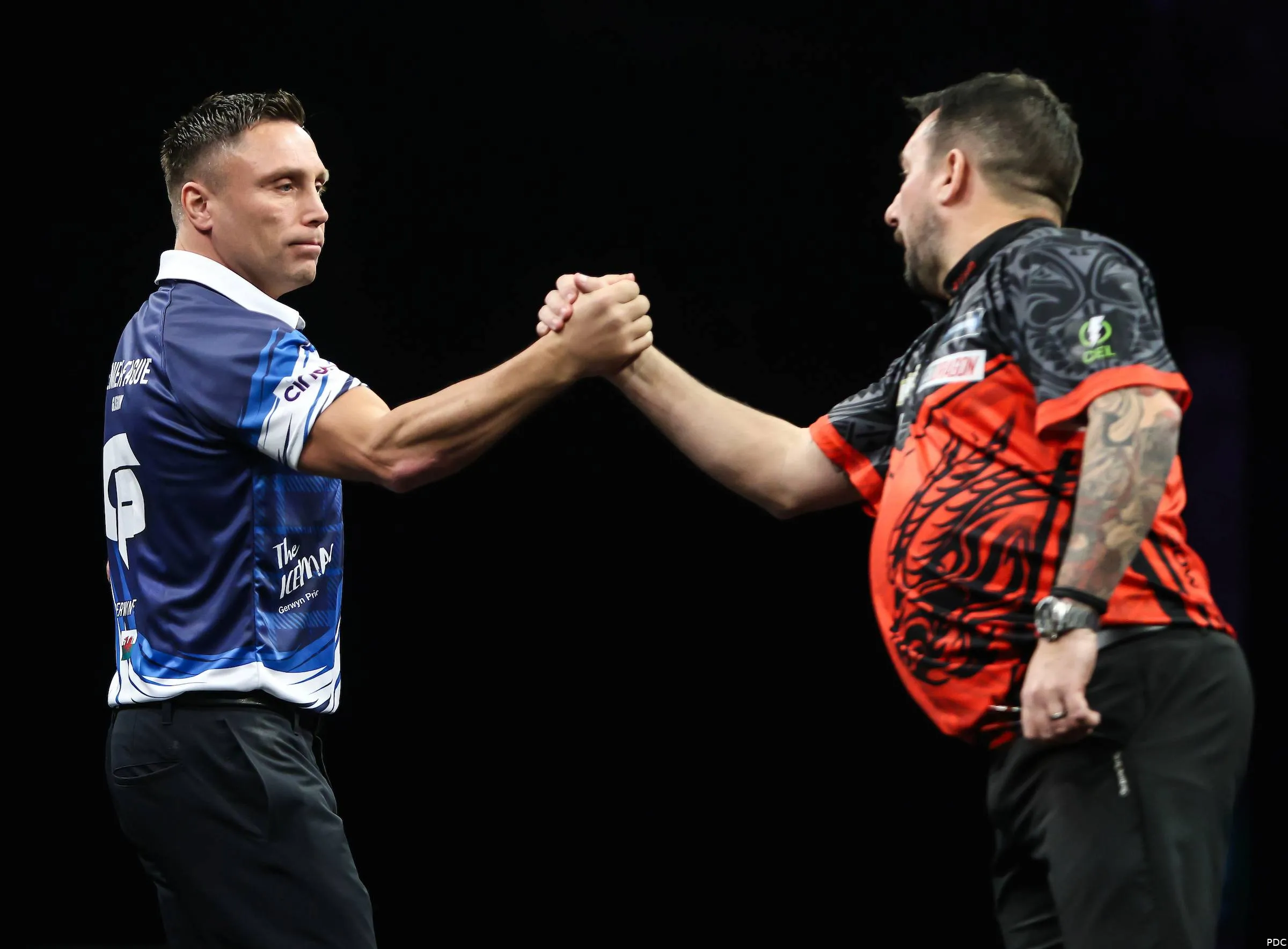 Gerwyn Price shakes hands with Jonny Clayton