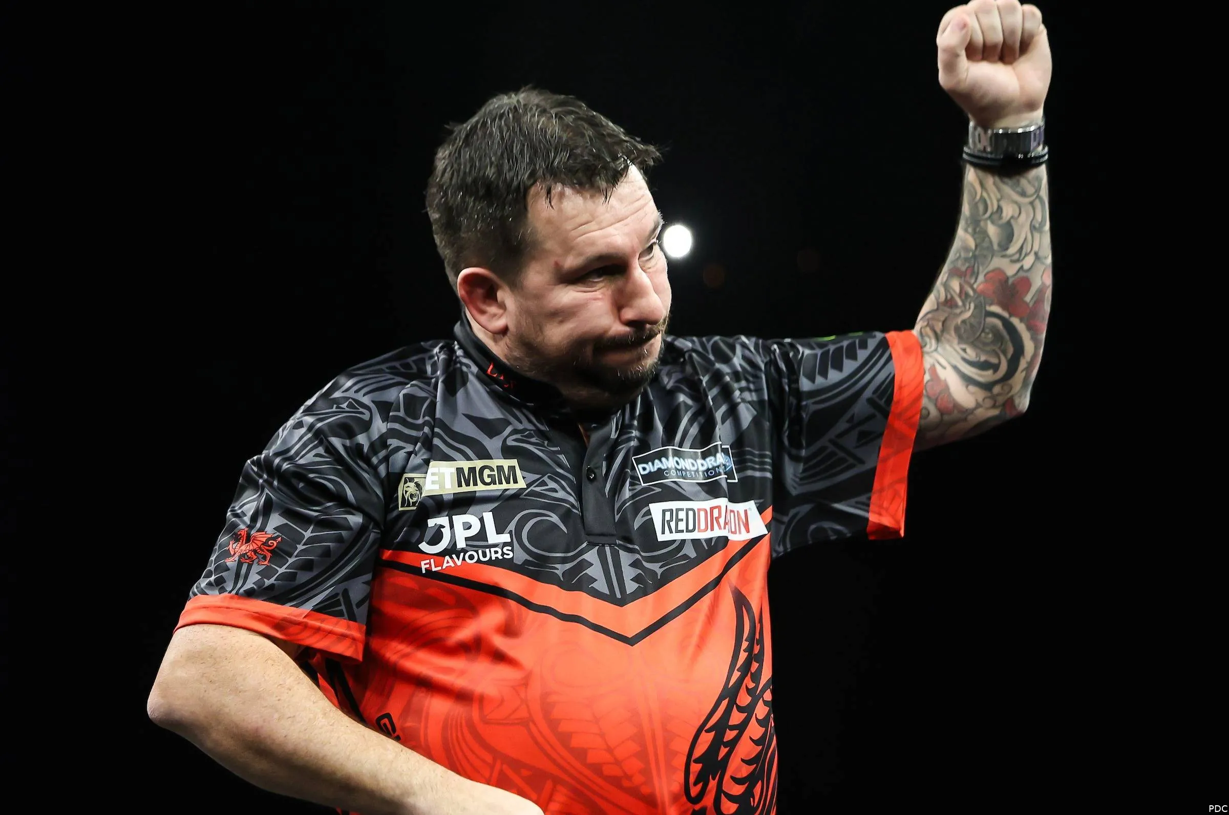 Jonny Clayton punches the air on night 3 of the 2026 Premier League Darts in Glasgow