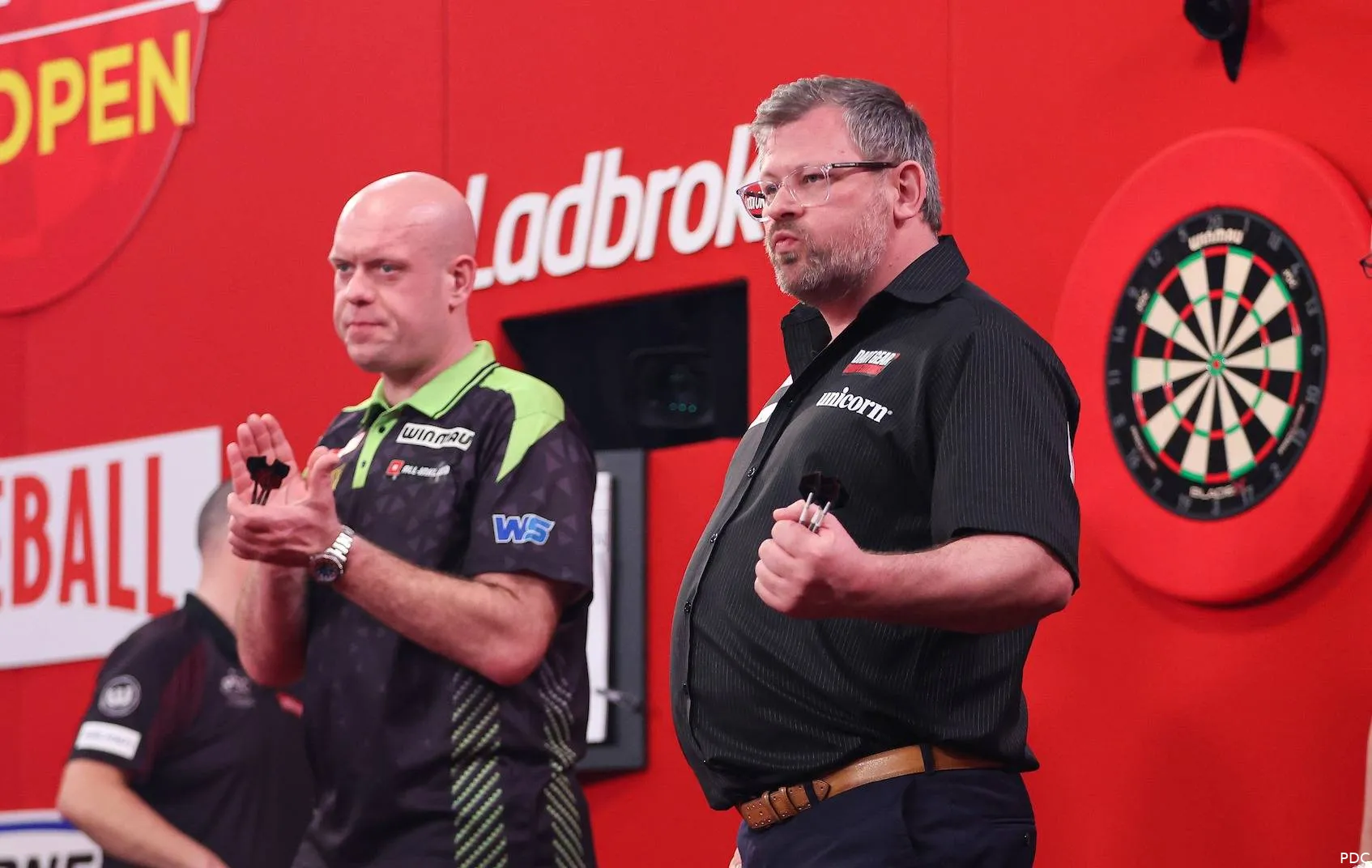 Michael van Gerwen applauds James Wade after their match at the 2026 UK Open