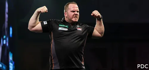 Dirk van Duijvenbode flexes his biceps.