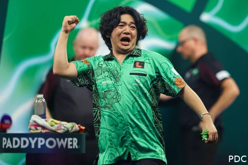 Motomu Sakai raises his fist in the air.