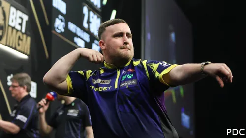 Luke Littler celebrates on stage