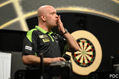 Michael van Gerwen blows a kiss with his hand.