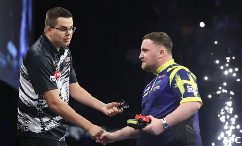 Gian van Veen and Luke Littler shake hands after a flare-up on stage.