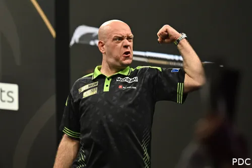 Michael van Gerwen pumps his fist in celebration.