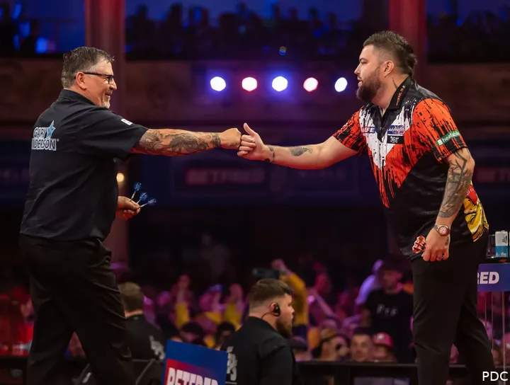 Gary Anderson takes on Michael Smith in the opening round of the World Grand Prix
