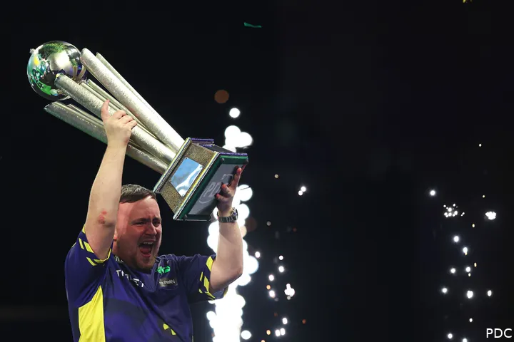 Littler celebrating with the Sid Waddell Trophy