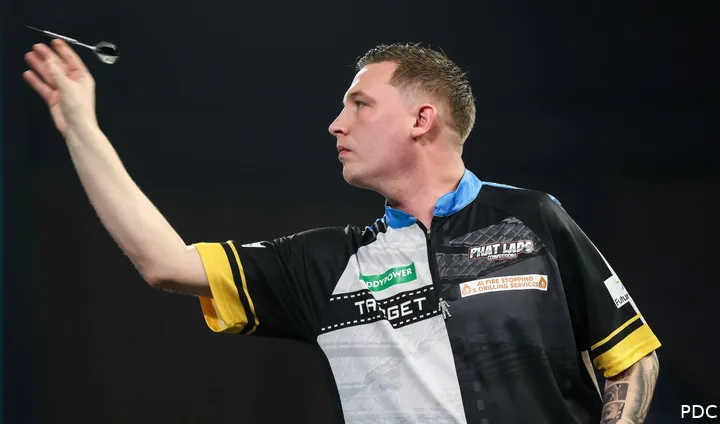 Chris Dobey throws his darts at the board.