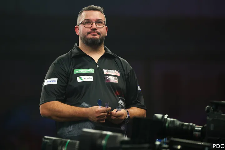 Cristo Reyes looks on.