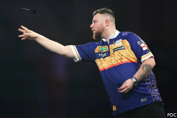 Josh Rock throws his dart