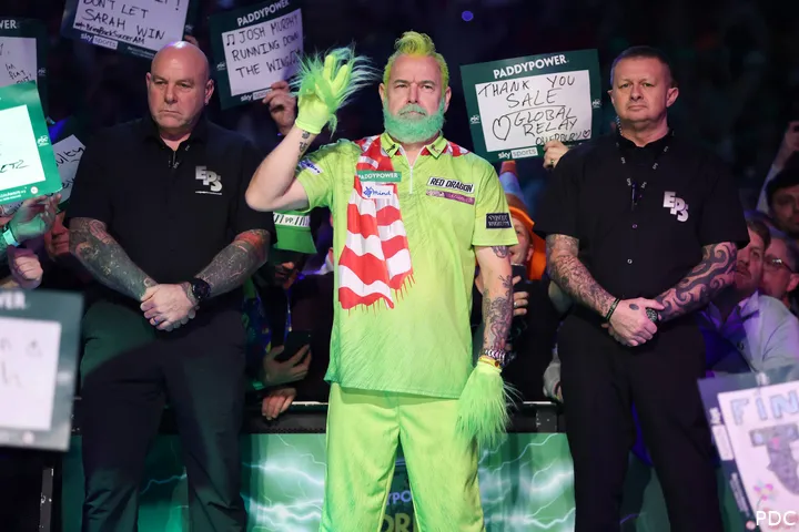 Peter Wright dressed as the Grinch.