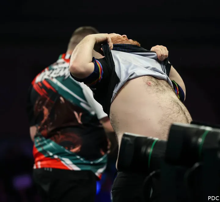 Justin Hood couldn’t resist lifting his shirt at the last World Darts Championship
