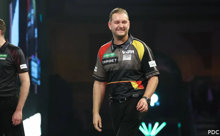 Dimitri van den Bergh standing on stage.