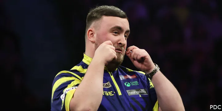 Luke Littler makes a crying gesture toward the crowd